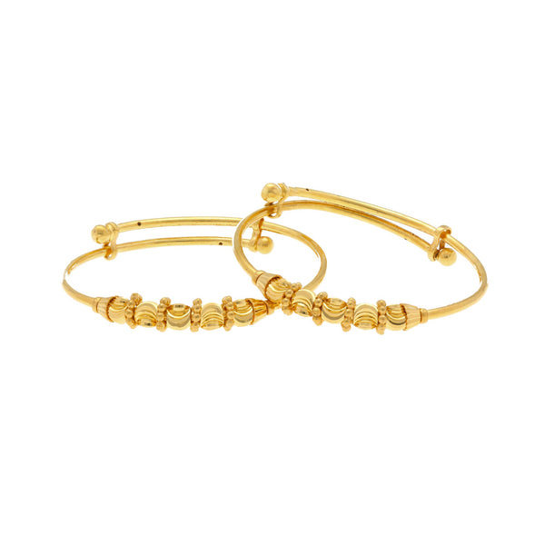 An image of a pair of Sunny 22K gold baby bangles from Virani Jewelers. | Get the entire family dressed up with the Sunny 22K gold baby bangles from Virani Jewelers!

Made...