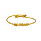 An image of a single 22K gold bangle with gold beads from Virani Jewelers. | Treat your little one to fine jewelry with this set of 22K gold bangles from Virani Jewelers!

Ma...