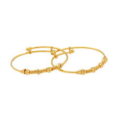 An image of two Spirit 22K gold baby bangles from Virani Jewelers.