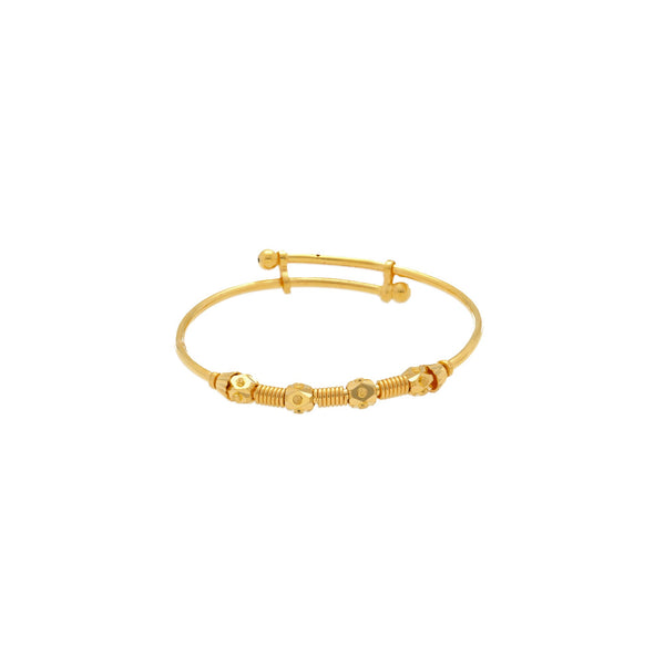 An image of one Spirit 22K gold baby bangle from Virani Jewelers. | Give a gift that your little one is sure to appreciate for many years with the Spirit 22K gold ba...