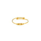 An image of the 22K gold bangle with an adjustable band and three gold beads and two spacers from Virani Jewelers. | Introduce your child to a world of elegance with this 22K gold baby bangle from Virani Jewelers!
...