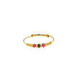 An image of a single 22K gold bangle from Virani Jewelers with gold, ruby, and black beads. | Celebrate your heritage and culture with these gorgeous 22K gold bangles from Virani Jewelers!

P...