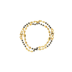 An image of the Riley 22K gold bracelet with gold and black beads from Virani Jewelers.