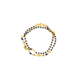 An image of the Kendall 22K gold bracelet with black beads from Virani Jewelers!