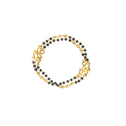 An image of the Reese 22K gold bracelet set with black beads from Virani Jewelers.