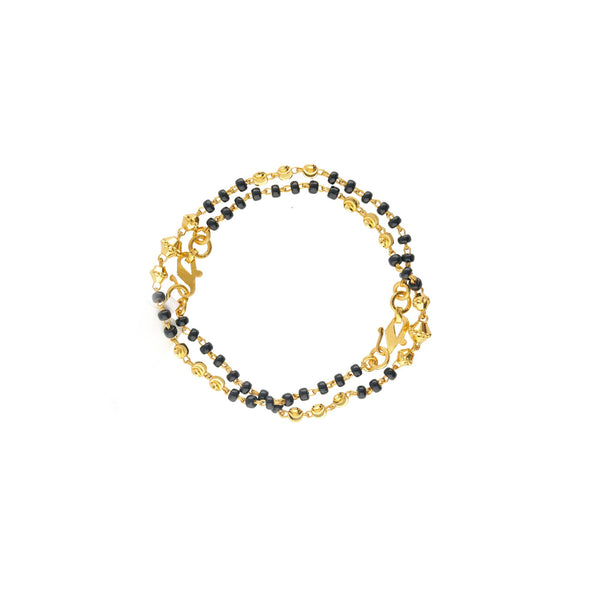 An image of the Reese 22K gold bracelet set with black beads from Virani Jewelers. | Treat your child to something special with the 22K Gold Reese Beaded Baby Bracelets from Virani J...