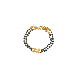 An image showing the double-chain 22K gold bracelet with black beads from Virani Jewelers.