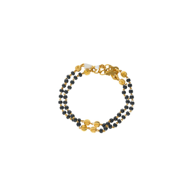 An image showing the double-chain 22K gold bracelet with black beads from Virani Jewelers. | Let your child show off their style with this 22K gold bracelet from Virani Jewelers!

Unique, in...