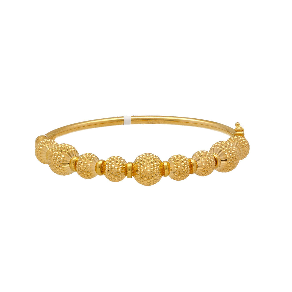 22K Yellow Gold Bangle W/ Gold Ball Accented Band | 


Accessorize your most casual attire with the brilliance of this 22K yellow gold bangle, beauti...