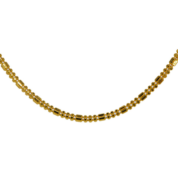 A closeup image of the 22K gold capsule and ball beads on the Indian chain from Virani. | Class up your wardrobe with a 22K gold chain from Virani Jewelers!

Features a shorter chain, mak...