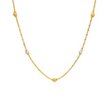 An image of a 22K gold necklace from Virani Jewelers with yellow and white gold beads spread throughout the wheat link chain. | Complement every outfit in your wardrobe with this gorgeous 22K gold chain from Virani Jewelers!
...