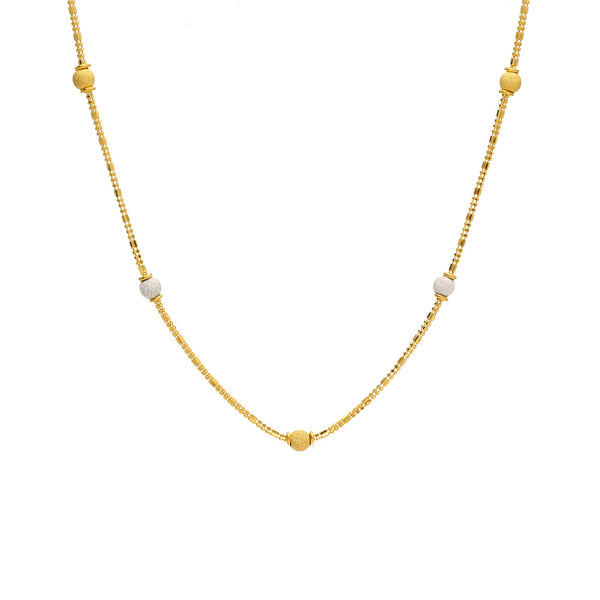 An image of a 22K gold necklace from Virani Jewelers with yellow and white gold beads spread throughout the wheat link chain. | Complement every outfit in your wardrobe with this gorgeous 22K gold chain from Virani Jewelers!
...