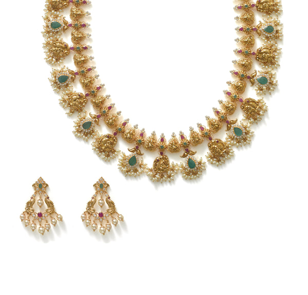 22K Yellow Gold Guttapusalu Necklace & Earrings Set W/ Pearls, Rubies, Emeralds, CZ Polki & Lord Ganesh Accents | Find the beauty in blending tradition and luxury with this most exquisite 22K yellow gold Guttapu...