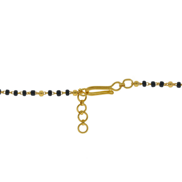 An image of the hook-in-eye clasp on a 22K gold necklace with black beads from Virani Jewelers | Add an elegant luster to your attire with this 22K gold Mangalsutra Chain from Virani Jewelers!

...