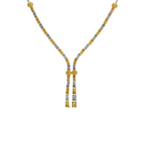 An image of an elegant, 22K gold Indian necklace crafted by Virani Jewelers | This 22K yellow and white gold set from Virani Jewelers is an exquisite way to complement any for...