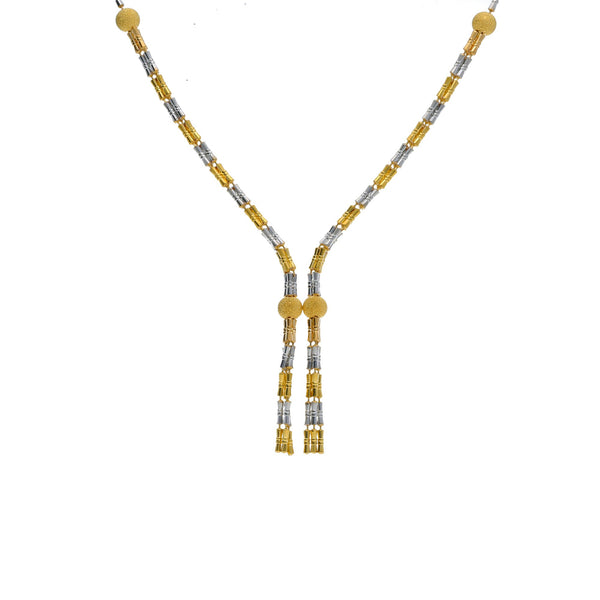 An image of an elegant, 22K gold Indian necklace crafted by Virani Jewelers | This 22K yellow and white gold set from Virani Jewelers is an exquisite way to complement any for...