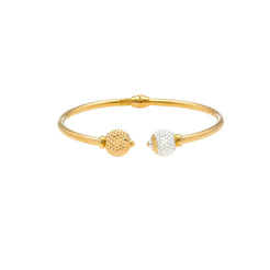 An image of a 22K gold bangle with contrasting white and yellow gold beads at the ends from Virani Jewelers.