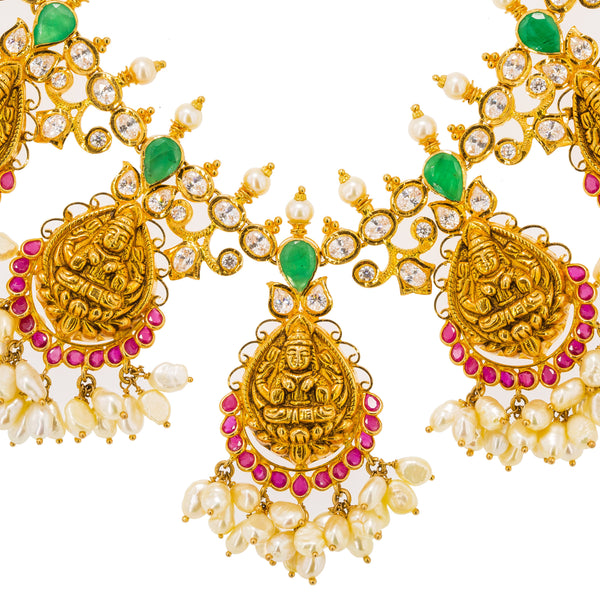 22K Yellow Gold Guttapusalu Necklace & Earrings Set W/ Rubies, Emeralds, CZ Gems, Pearls & Laxmi Accents | Stand out with elegance in the 22K yellow gold Guttapusalu necklace and earrings set from Virani ...