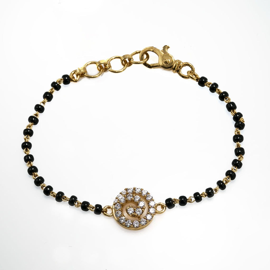 22K Yellow Gold Black Bead Bracelet W/ CZ Gems & Swirl Pendant |  22K Yellow Gold Black Bead Bracelet W/ CZ Gems & Swirl Pendant for women. This sleek black b...