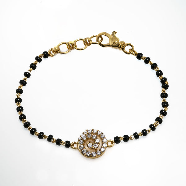 22K Yellow Gold Black Bead Bracelet W/ CZ Gems & Swirl Pendant |  22K Yellow Gold Black Bead Bracelet W/ CZ Gems & Swirl Pendant for women. This sleek black b...