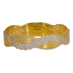 One 22K multi-tone bangle featuring an abstract crossover design.