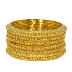 Set of six 22K yellow gold bangles from Virani Jewelers featuring thick gold baubles and intricate beaded filigree details around each band.